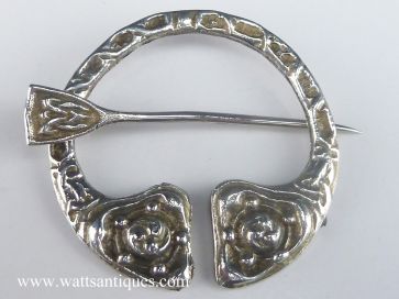 SILVER PENNANULAR BROOCH